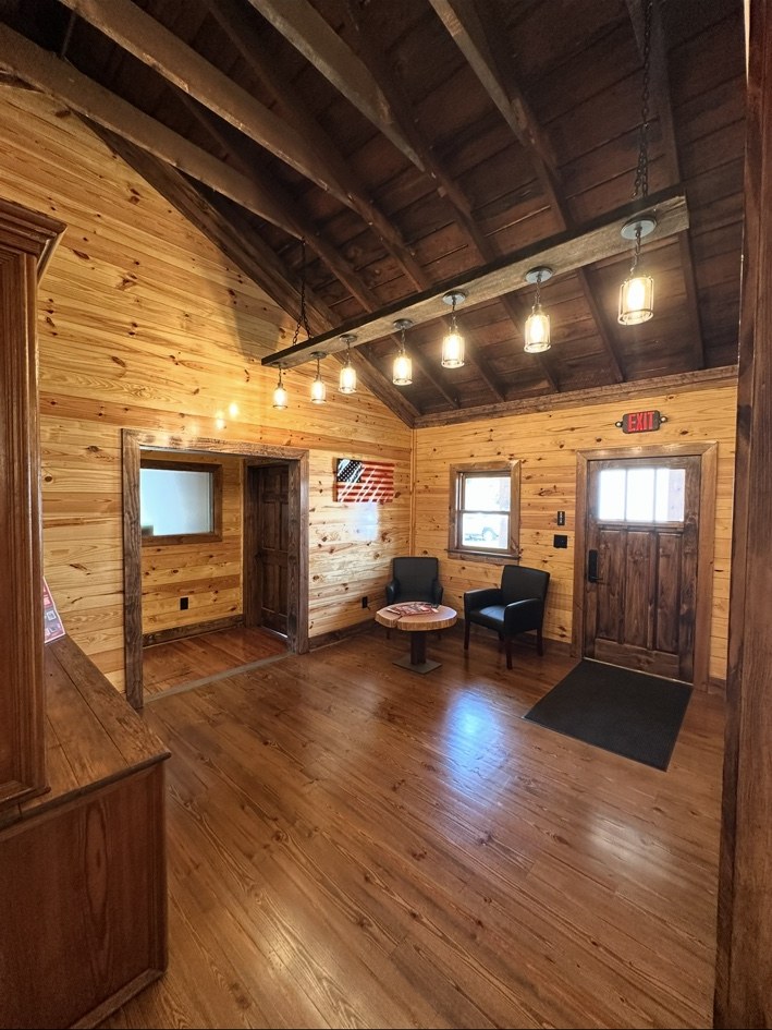 Historic train depot renovation with wood walls and a vaulted ceiling