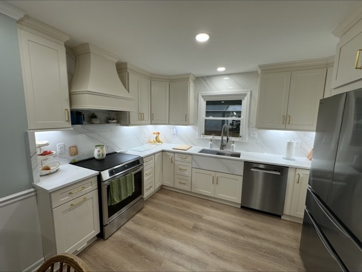 Kitchen cabinetry and stone backsplash — After
